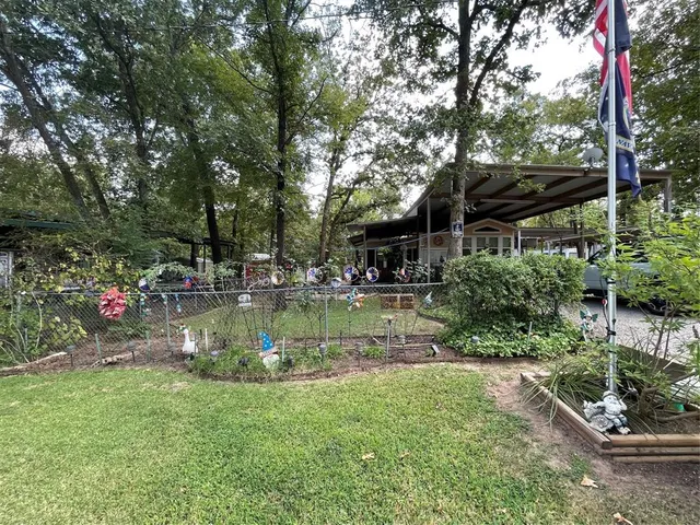 a view of a house with swimming pool and sitting area