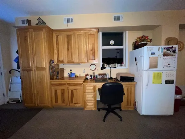 a living room with furniture toys and a window