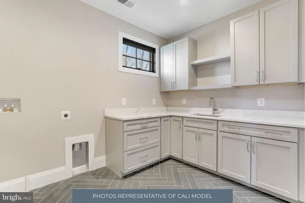 a kitchen with cabinets and window