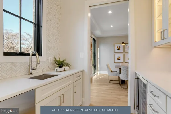 a bathroom with a sink and a large mirror
