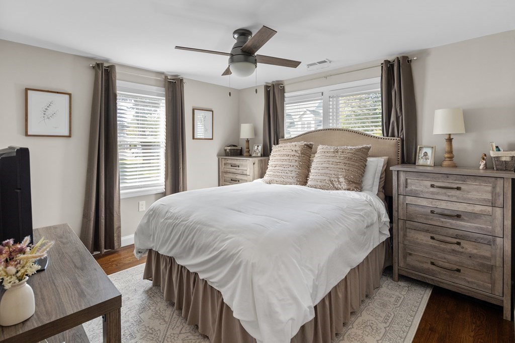 25 Eames Street North Reading, MA 01864 - Photo 13 of 25 a bedroom with a bed a flat screen tv and dresser