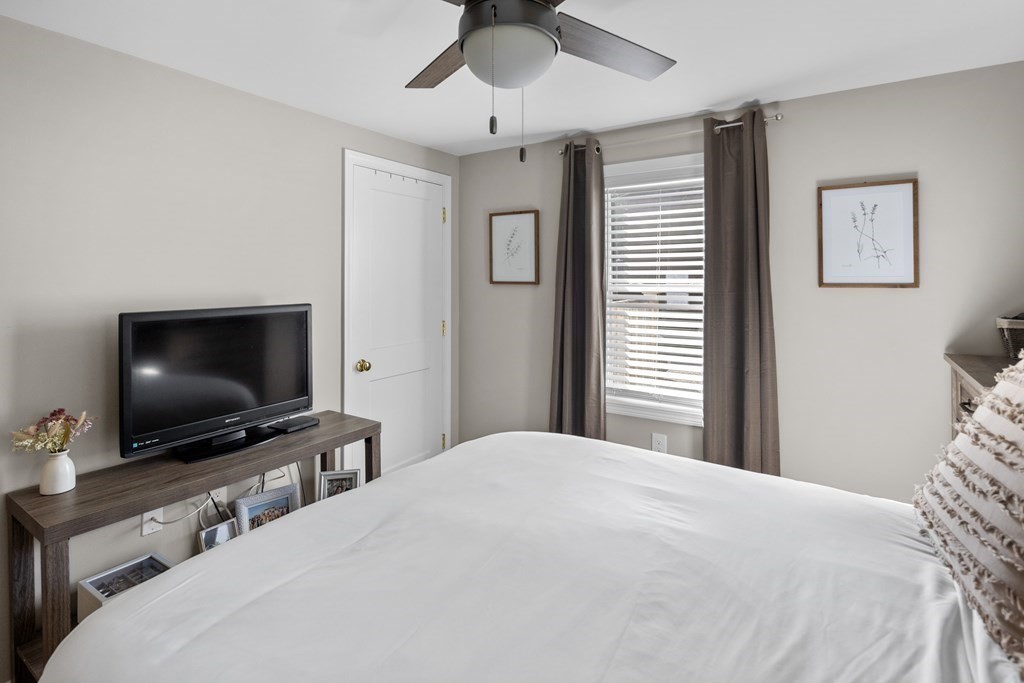 25 Eames Street North Reading, MA 01864 - Photo 14 of 25 a bedroom with a bed and a flat screen tv