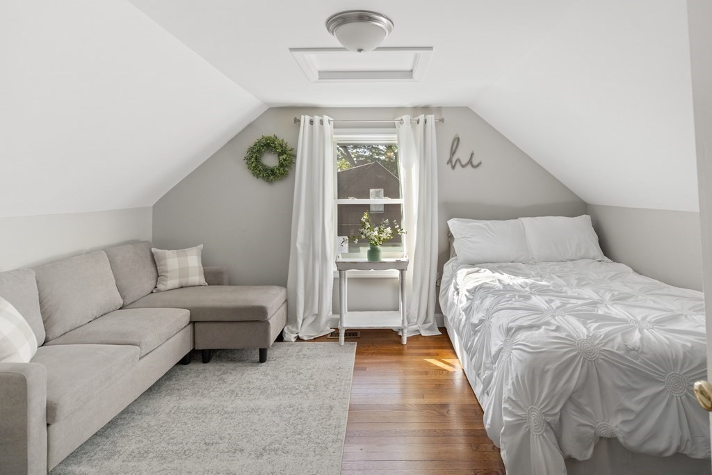 25 Eames Street North Reading, MA 01864 - Photo 19 of 25 a bedroom with a large bed and a couch