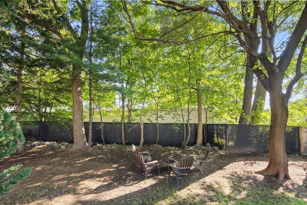 25 Eames Street North Reading, MA 01864 - Photo 23 of 25 a backyard of a house with a tree