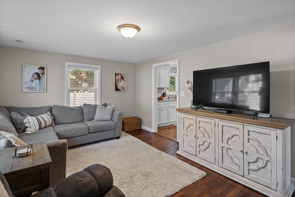 25 Eames Street North Reading, MA 01864 - Photo 3 of 25 a living room with furniture and a flat screen tv