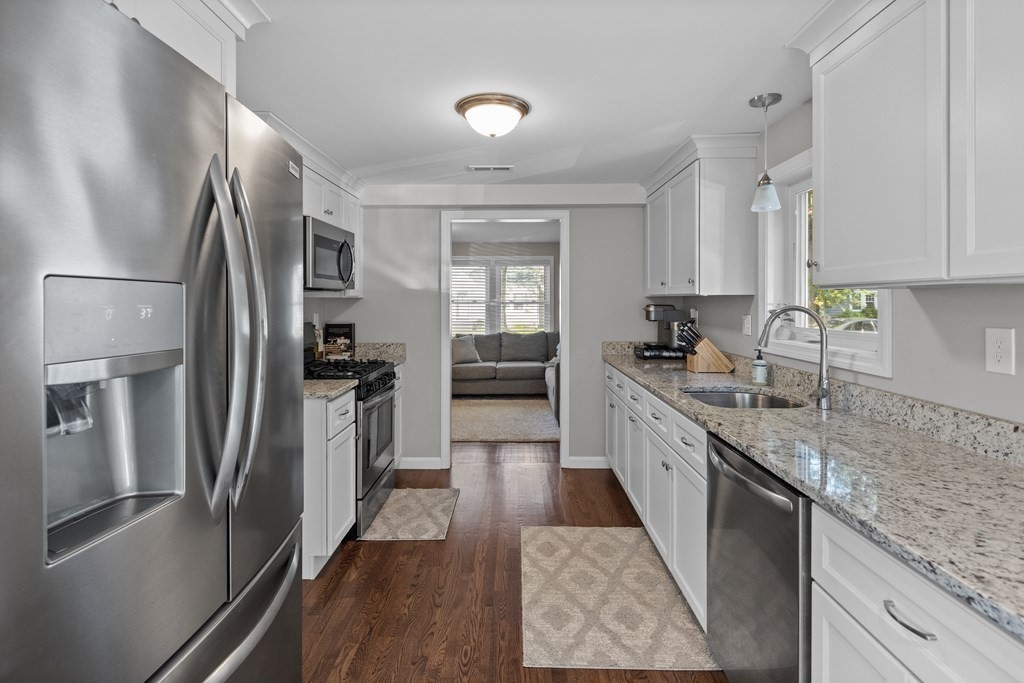 25 Eames Street North Reading, MA 01864 - Photo 7 of 25 a large kitchen with a large window and stainless steel appliances