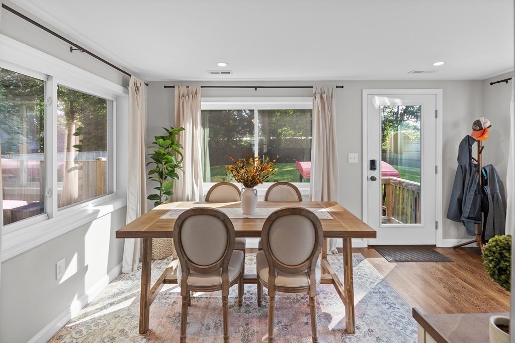 25 Eames Street North Reading, MA 01864 - Photo 8 of 25 a living room with furniture a window and a flat screen tv