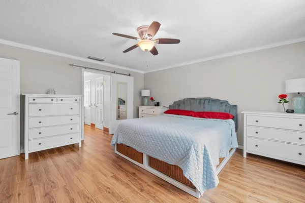 a bedroom with a bed and a dresser