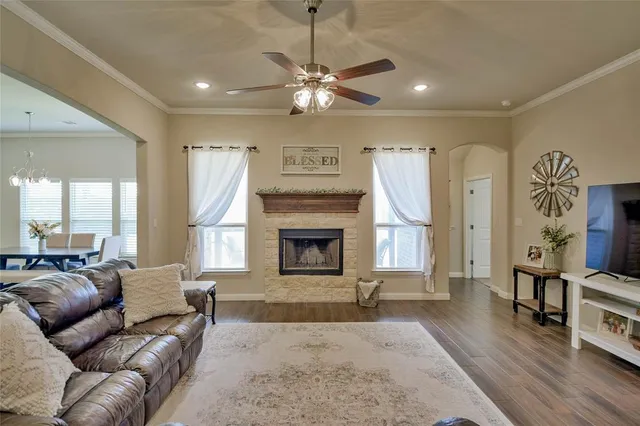 a living room with furniture and a fireplace