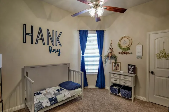 a view of a livingroom with furniture and a flat screen tv