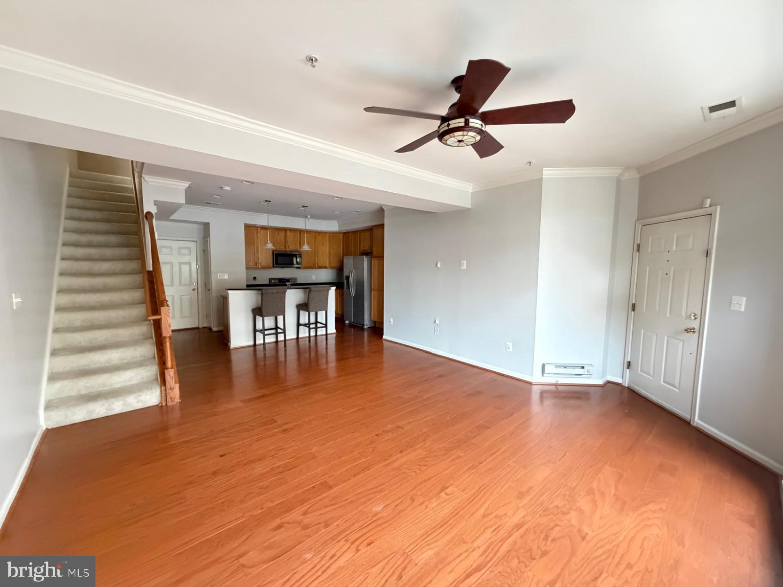 7248 Elkridge Crossing Way Elkridge, MD 21075 - Photo 12 of 47 a view of empty room with wooden floor and fan