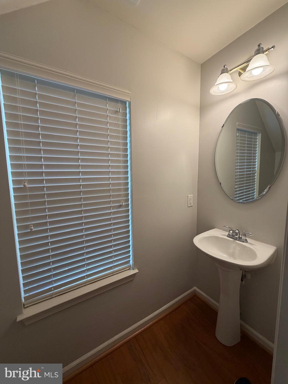 7248 Elkridge Crossing Way Elkridge, MD 21075 - Photo 14 of 47 a bathroom with a sink and a mirror