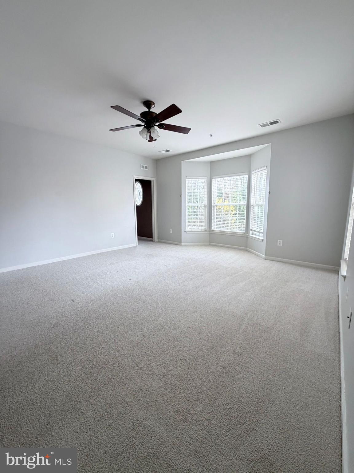 7248 Elkridge Crossing Way Elkridge, MD 21075 - Photo 19 of 47 a view of an empty room with a window