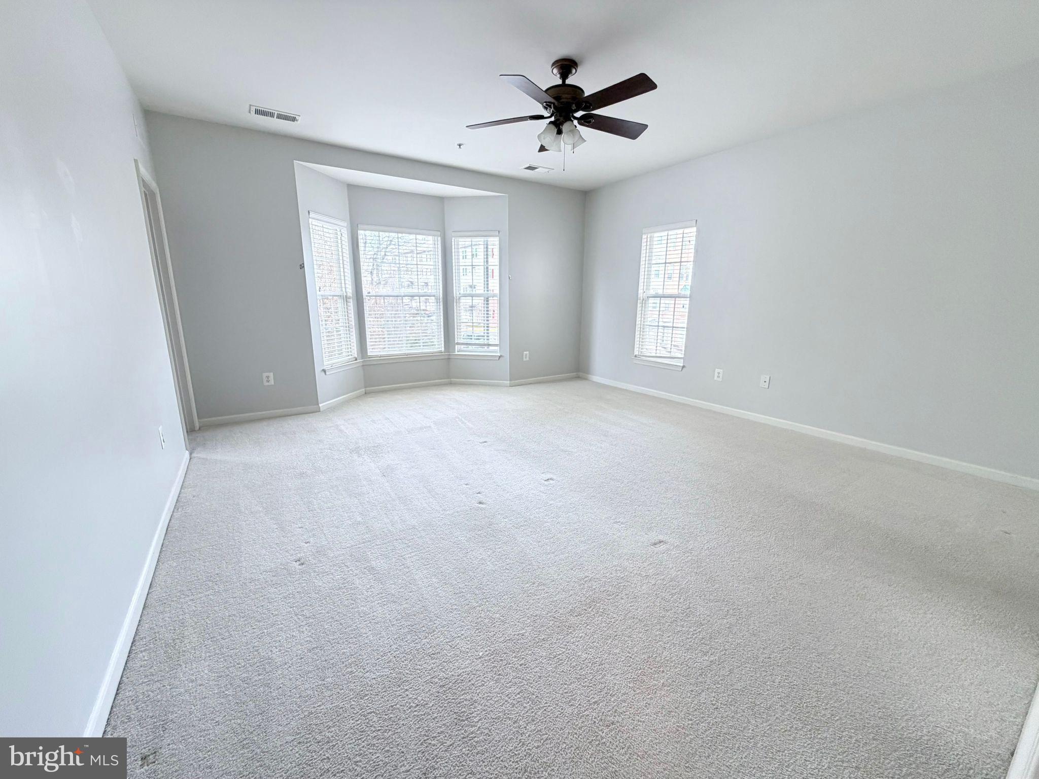 7248 Elkridge Crossing Way Elkridge, MD 21075 - Photo 21 of 47 a view of an empty room with a window