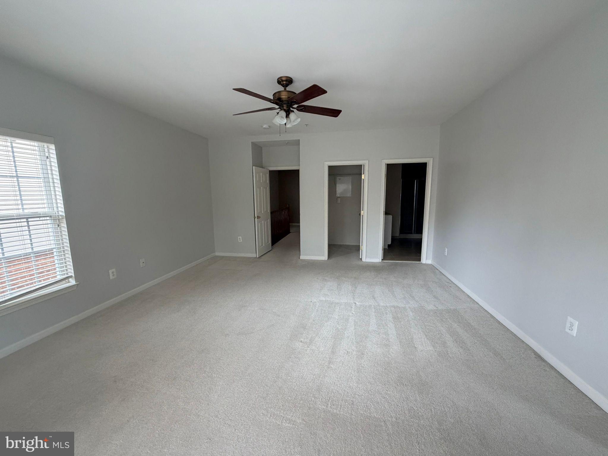 7248 Elkridge Crossing Way Elkridge, MD 21075 - Photo 22 of 47 a view of a livingroom with a ceiling fan and window
