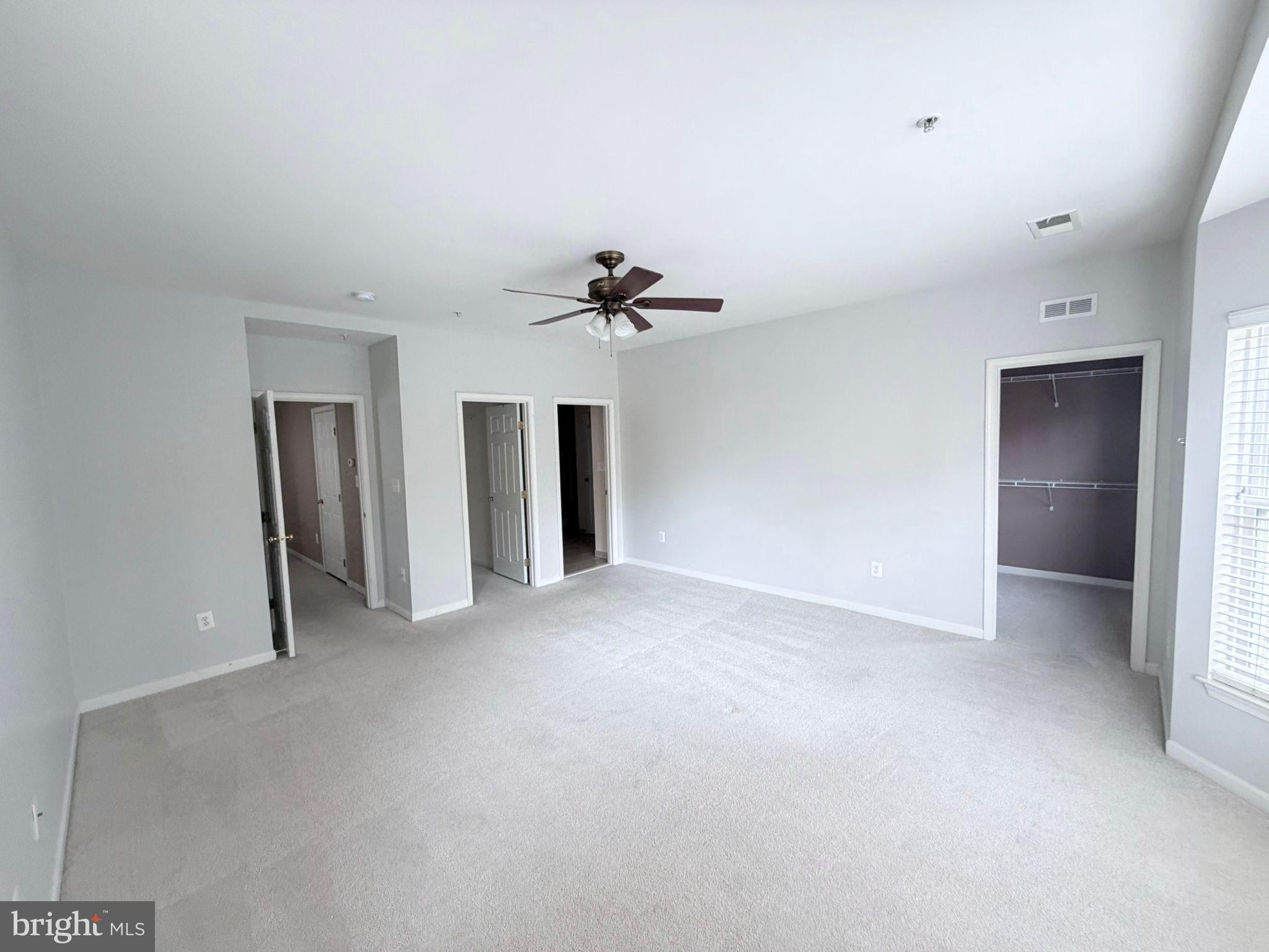 7248 Elkridge Crossing Way Elkridge, MD 21075 - Photo 23 of 47 a view of a livingroom with a ceiling fan and window