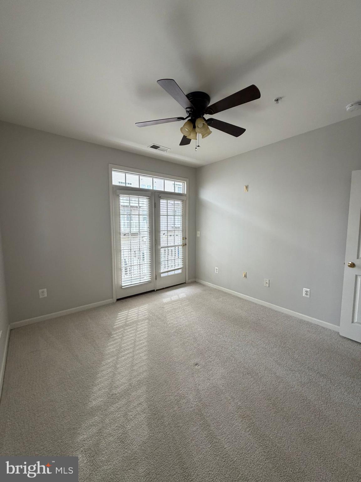 7248 Elkridge Crossing Way Elkridge, MD 21075 - Photo 27 of 47 a view of an empty room with a window