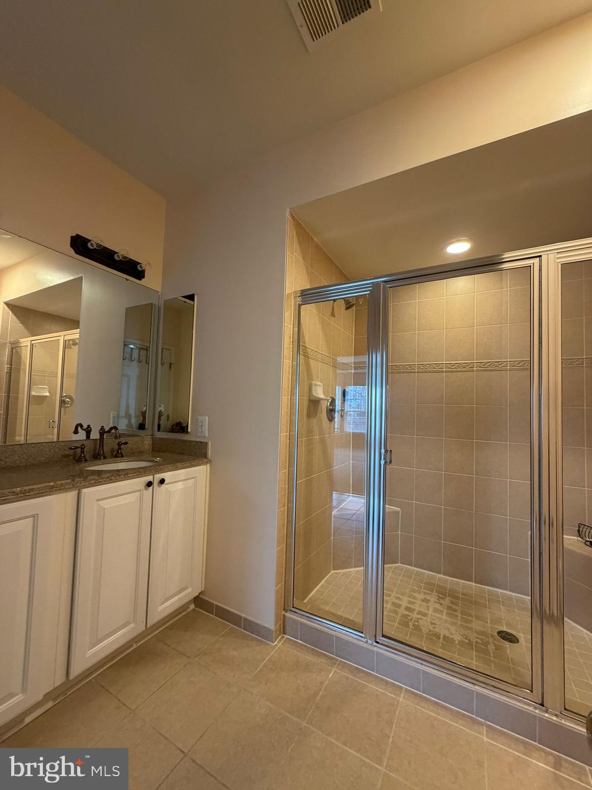 7248 Elkridge Crossing Way Elkridge, MD 21075 - Photo 33 of 47 a bathroom with double vanity and a shower