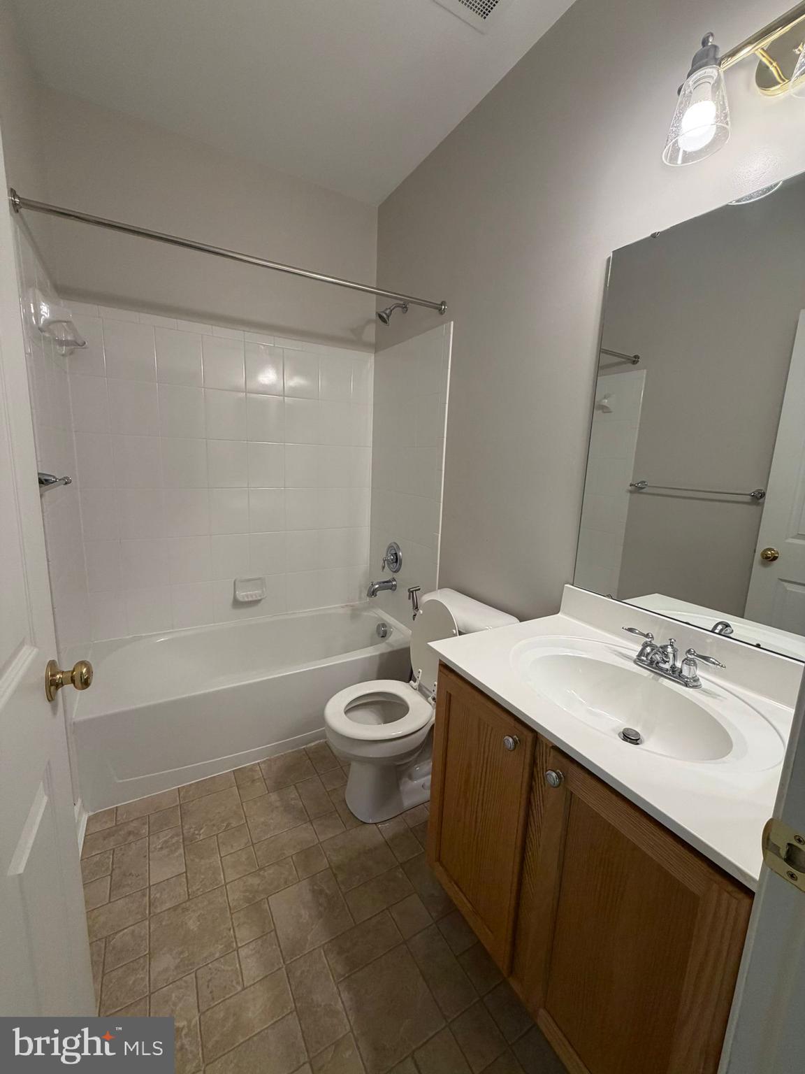 7248 Elkridge Crossing Way Elkridge, MD 21075 - Photo 34 of 47 a bathroom with a sink a toilet and shower