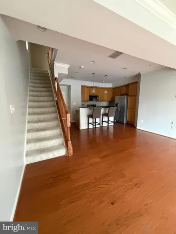 a view of dining room with furniture and wooden floor