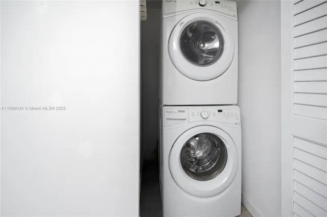 a view of a chair and table in the balcony