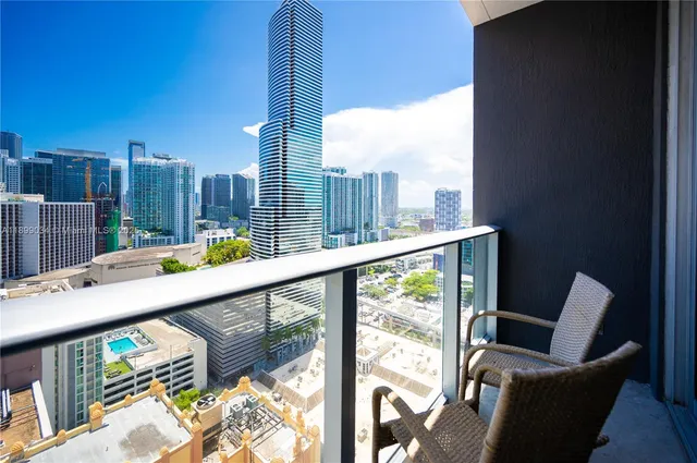 a view of swimming pool with outdoor seating and plants
