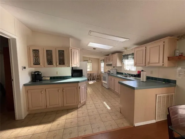 a view of a dining room with furniture and window