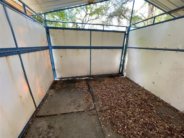 a view of a park with large trees