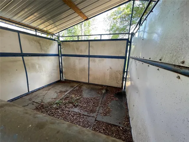 a view of a park with large trees