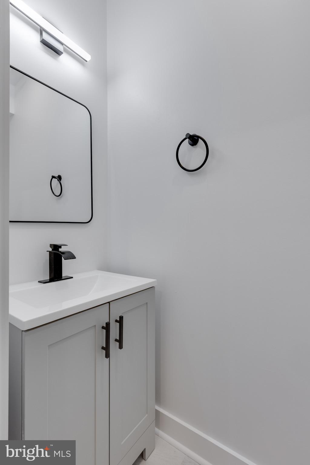 2061 North 8th Street, Unit 3 Philadelphia, PA 19122 - Photo 3 of 11 a bathroom with a sink and mirror