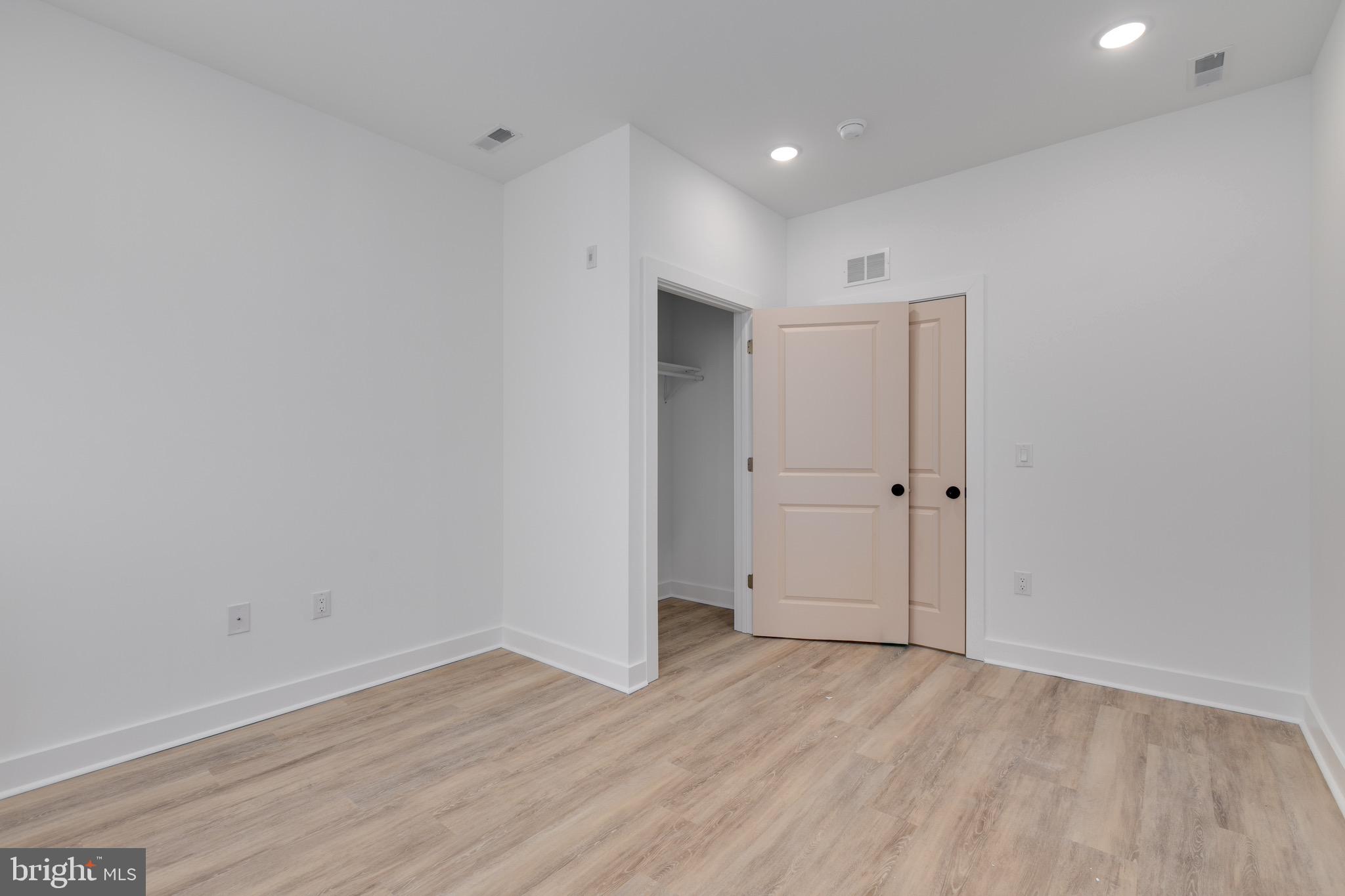 2061 North 8th Street, Unit 3 Philadelphia, PA 19122 - Photo 7 of 11 a view of an empty room with wooden floor