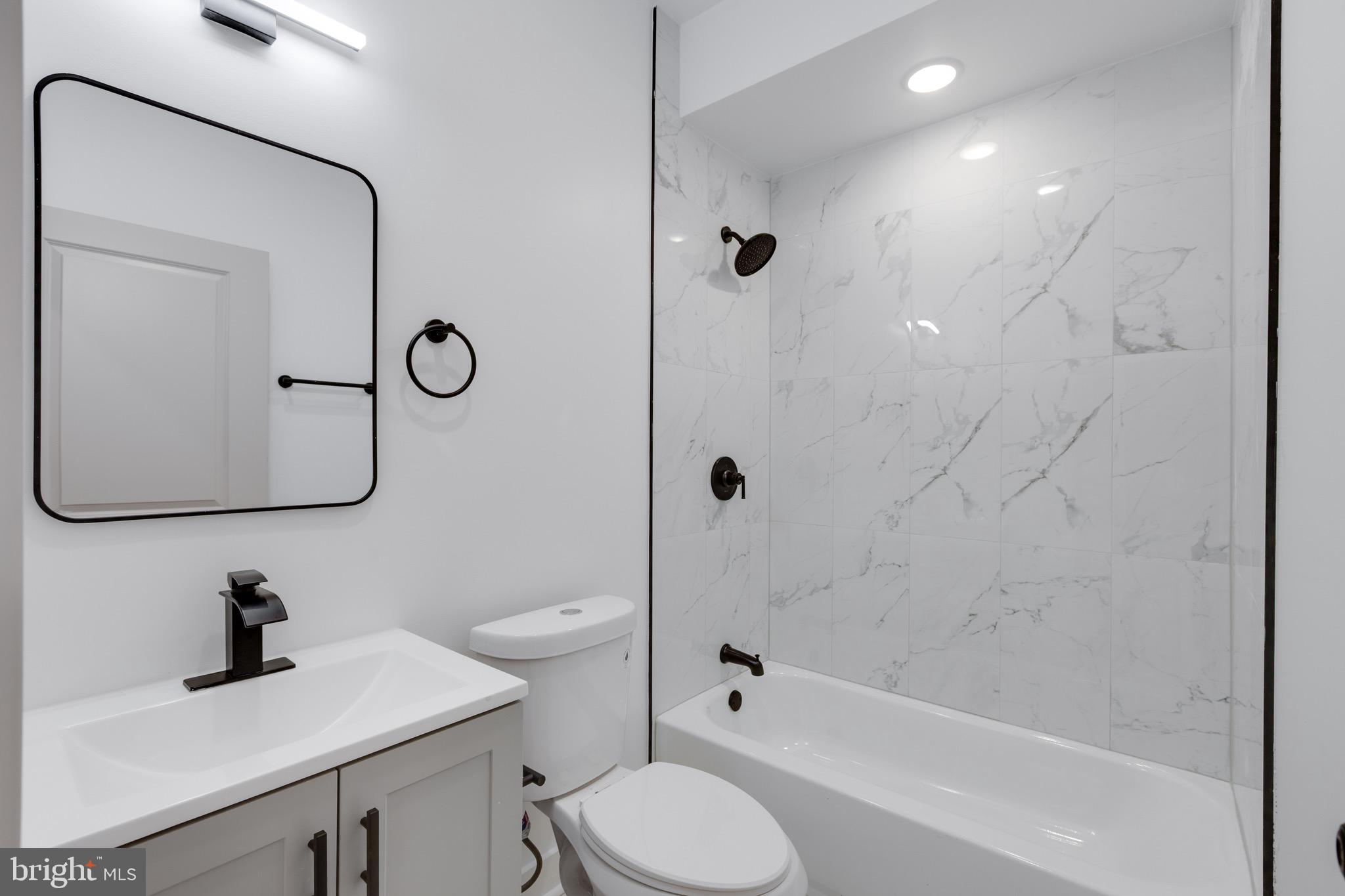 2061 North 8th Street, Unit 3 Philadelphia, PA 19122 - Photo 8 of 11 a bathroom with a sink toilet and shower