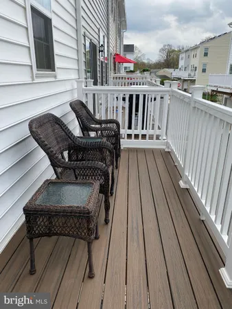a roof deck view with a seating space