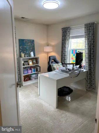 a workspace with furniture and window