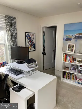 a workspace with furniture and bookshelf