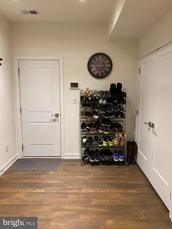a view of room with wooden floor