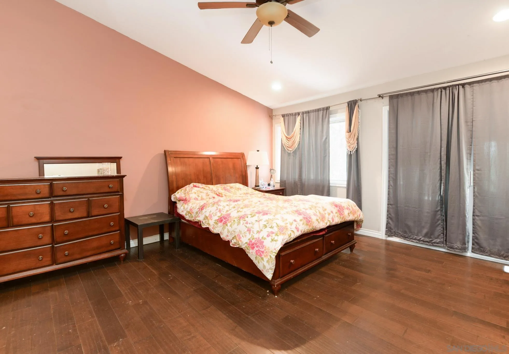 30015 Ridge Creek Road Valley Center, CA 92082 - Photo 12 of 59 a bed sitting in a spacious bedroom next to a window and a chandelier