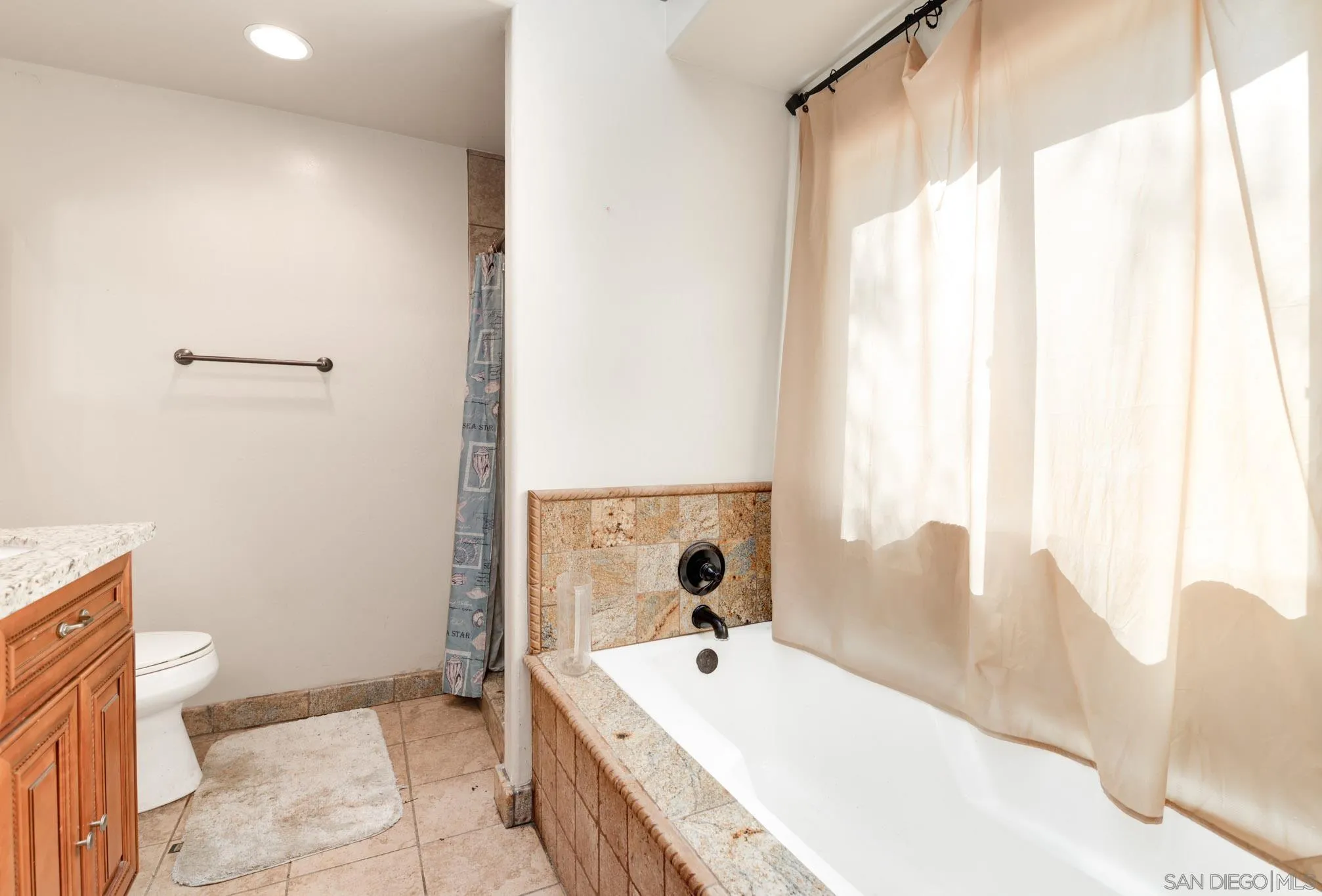 30015 Ridge Creek Road Valley Center, CA 92082 - Photo 14 of 59 a spacious bathroom with a tub sink and mirror