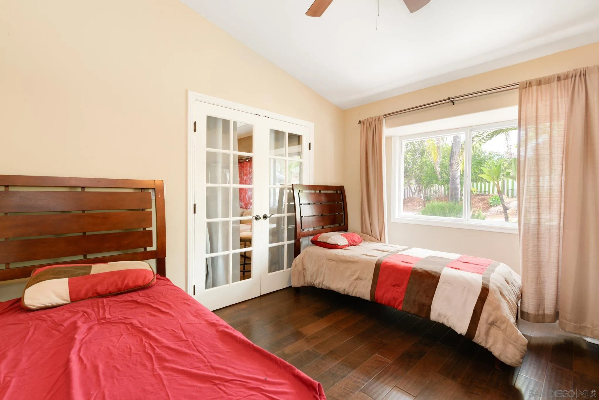 30015 Ridge Creek Road Valley Center, CA 92082 - Photo 17 of 59 a bedroom with a bed and wooden floor