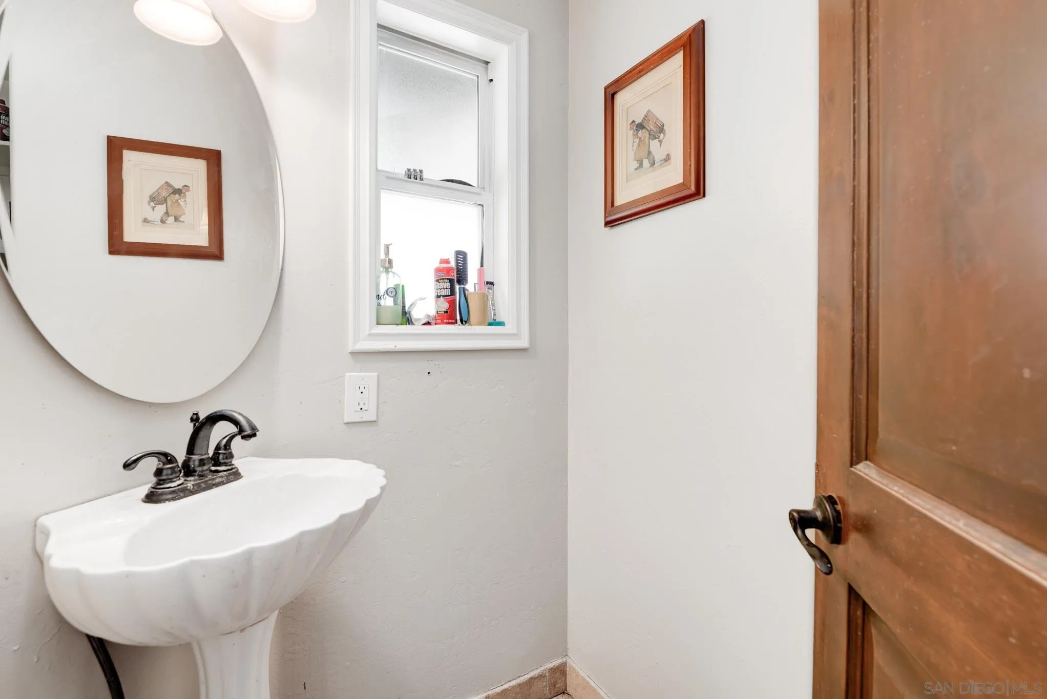 30015 Ridge Creek Road Valley Center, CA 92082 - Photo 18 of 59 a bathroom with a sink mirror and vanity