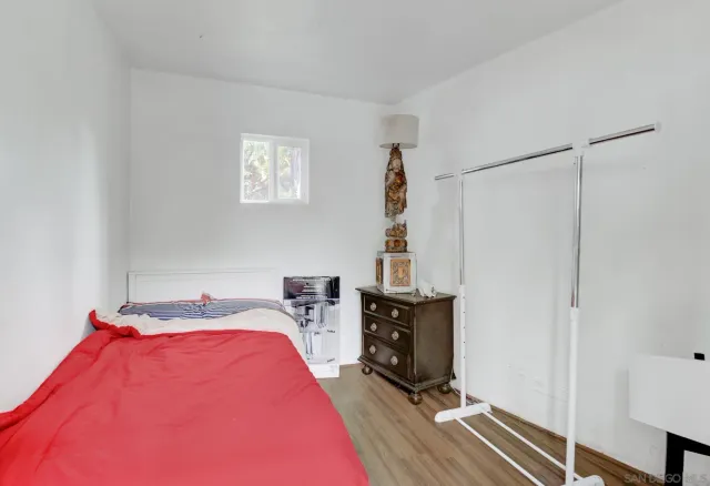 a bed room with a bed and a window