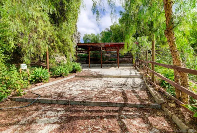 a view of outdoor space with deck and tree