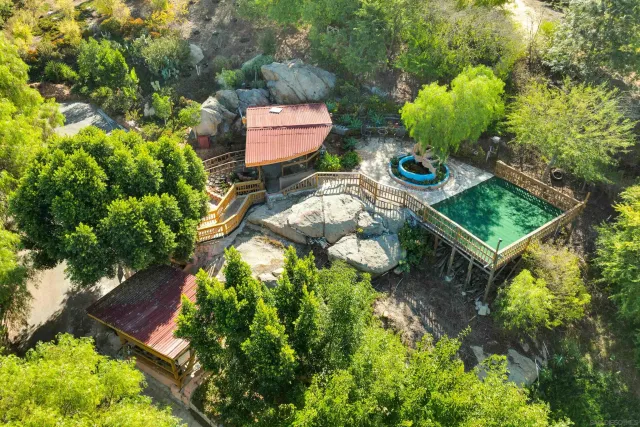 a view of a house with a cars park