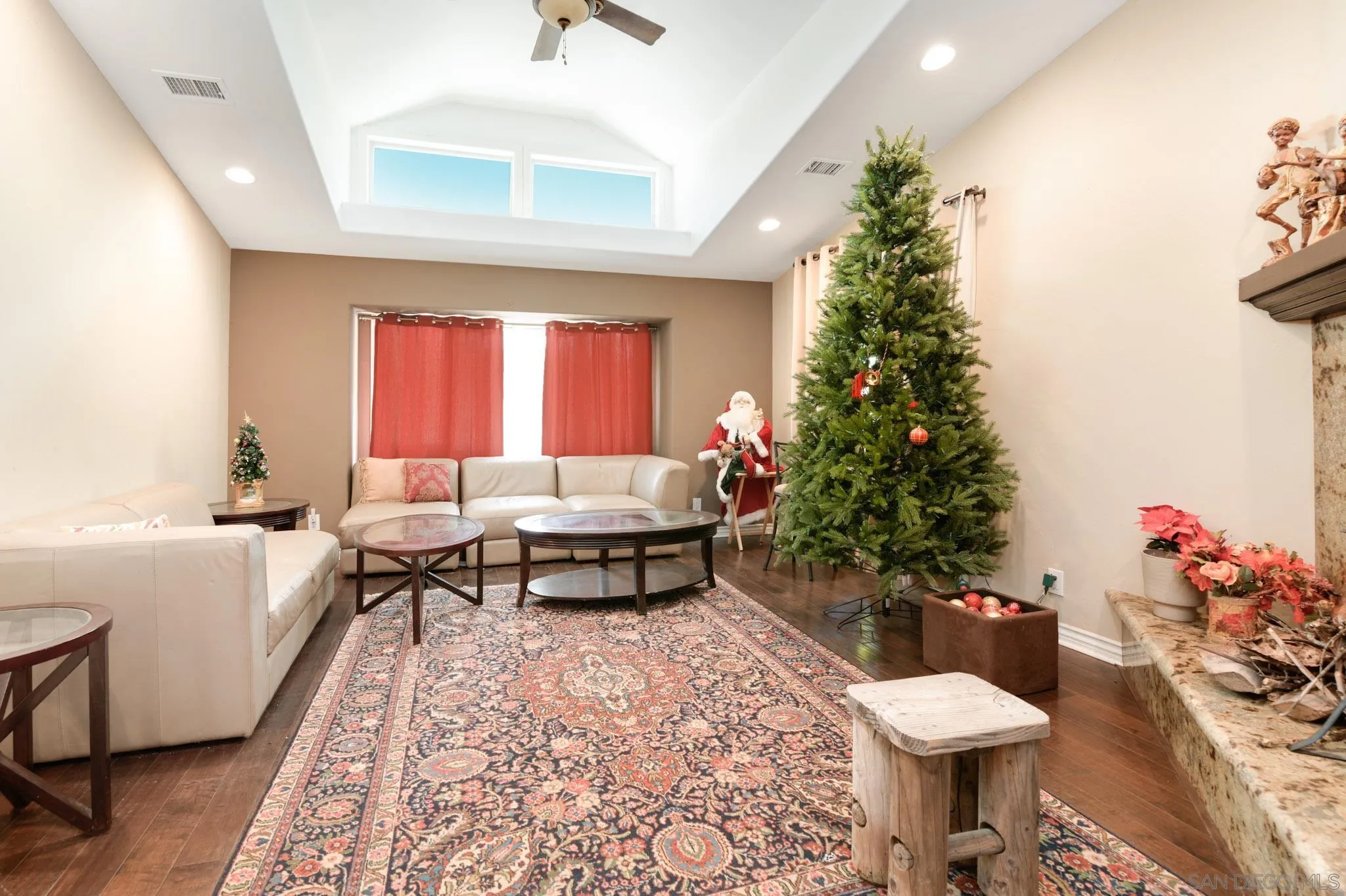 30015 Ridge Creek Road Valley Center, CA 92082 - Photo 5 of 59 a living room with a couch and a potted plant