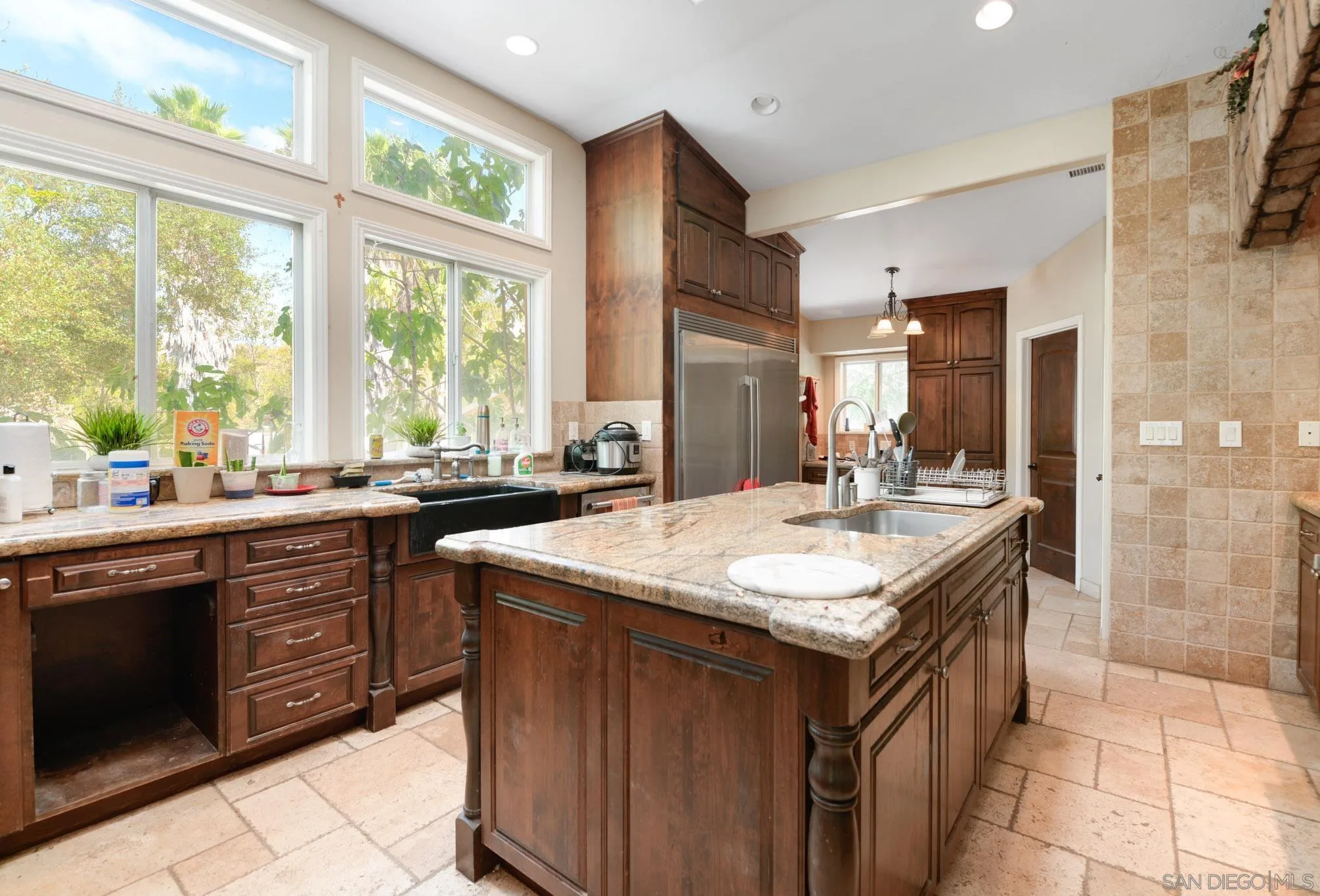 30015 Ridge Creek Road Valley Center, CA 92082 - Photo 10 of 59 a kitchen with kitchen island granite countertop a sink and a stove