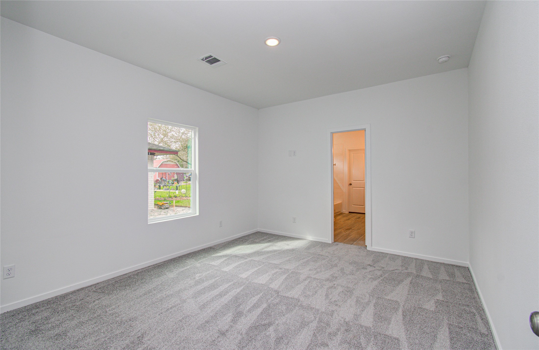 211 19th Hempstead, TX 77445 - Photo 15 of 21 Primary Bedroom
Spacious primary bedroom featuring comfortable carpet flooring.
