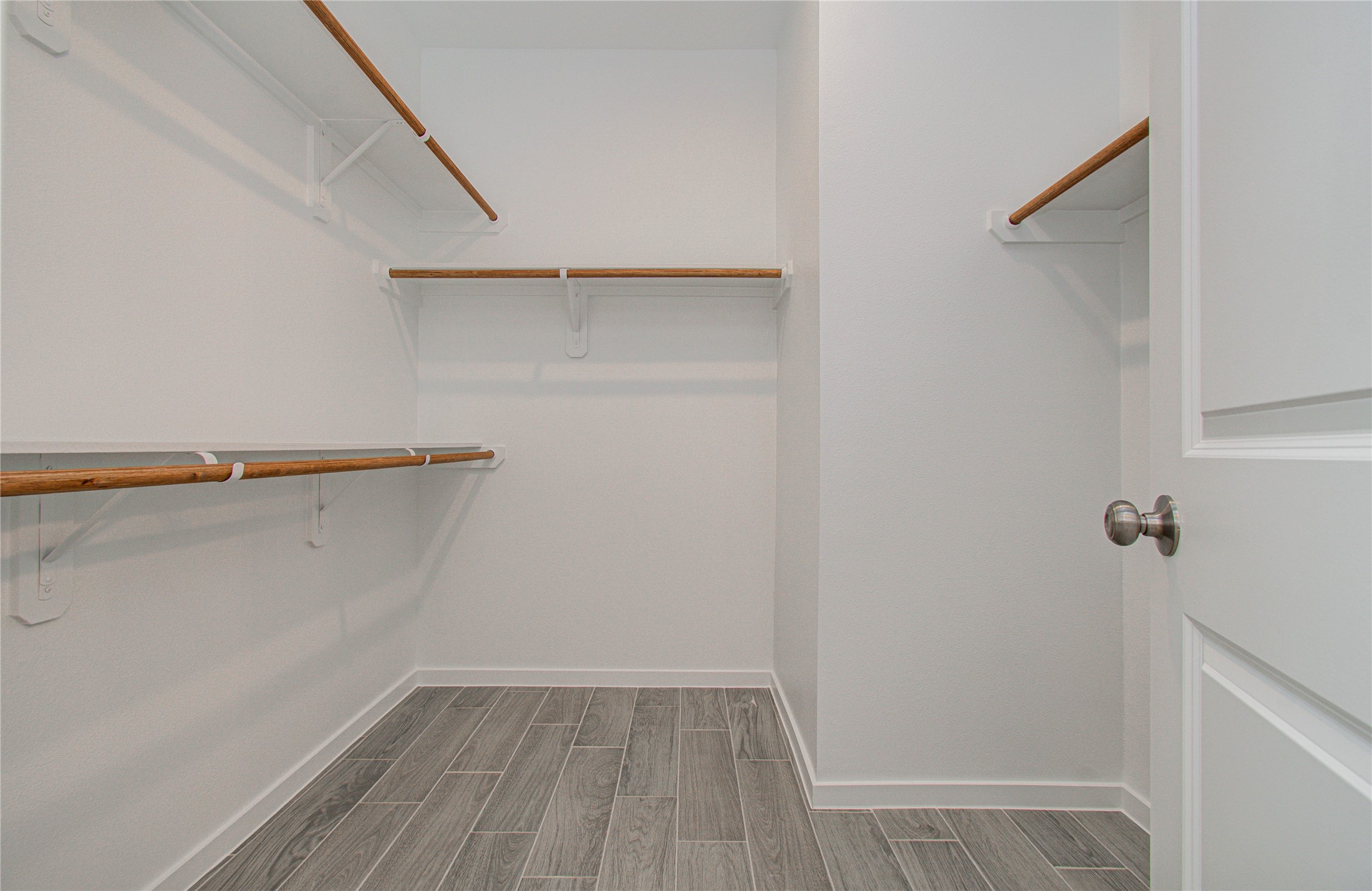 211 19th Hempstead, TX 77445 - Photo 18 of 21 Walk-in Closet
Large walk-in closet located in the primary suite.