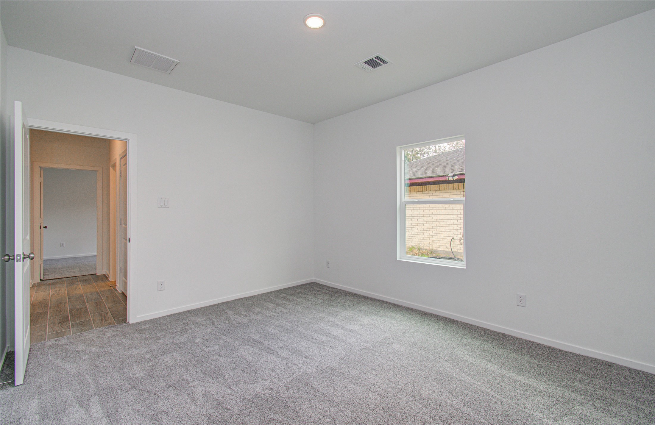 211 19th Hempstead, TX 77445 - Photo 19 of 21 Secondary Bedroom
Comfortable secondary bedroom with carpet flooring.
