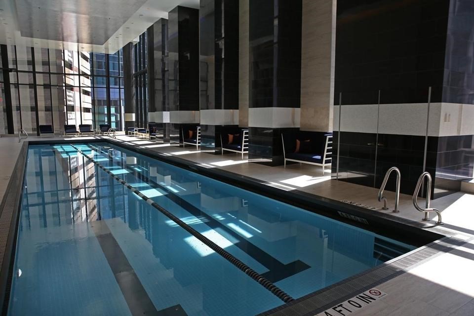 1 Franklin Street, Unit 2409 Boston, MA 02110 - Photo 18 of 19 a kitchen with a sink a stove and cabinets