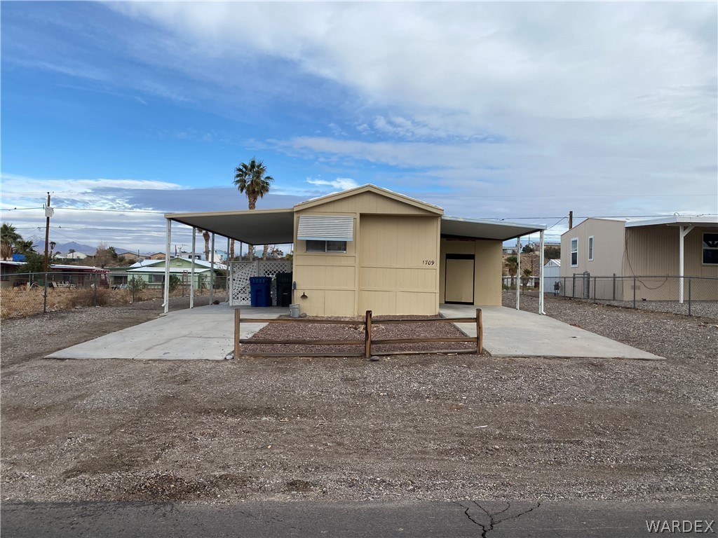 1709 Talc Road Bullhead City, AZ 86442 - Photo 1 of 29 a house view with a backyard space